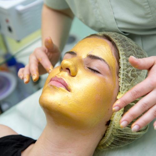 Gold facial mask at the spa salon